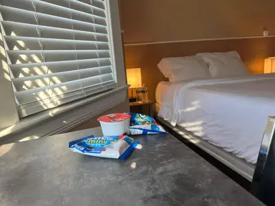 a bedroom with a bed and some food on the floor at Puro Cuarto | Room 10 min Downtown, 15 to Airport in Cleveland