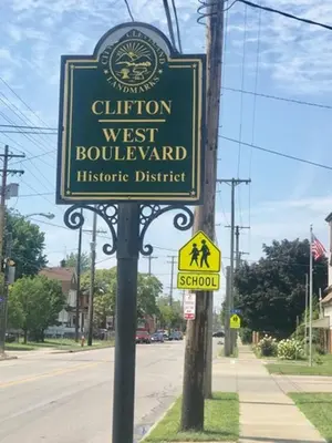 a sign on the side of a street at Puro Cuarto | Room 10 min Downtown, 15 to Airport in Cleveland