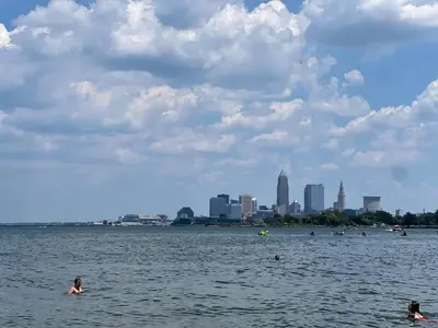 a group of people swimming in a large body of water at Puro Cuarto | Room 10 min Downtown, 15 to Airport in Cleveland