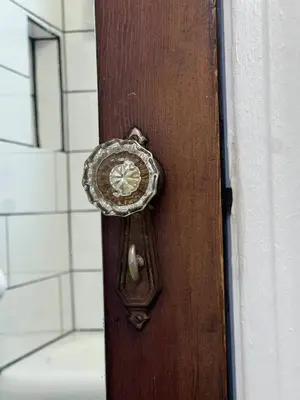a door with a clock on the side of it at Super close to Cleveland Clinic Fairview Colibri in Cleveland