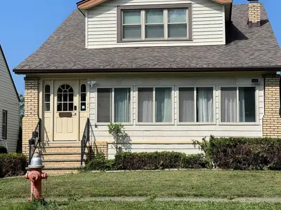 a house with a red fire hydrant in front of it at Super close to Cleveland Clinic Fairview Colibri in Cleveland