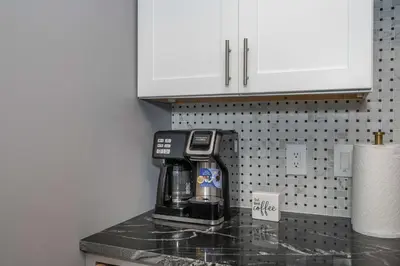 a kitchen counter top with a coffee maker on it at Luxury Mt Adams Retreat Apt 1 in Cincinnati