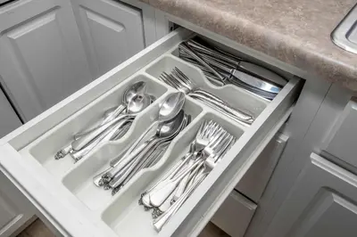 a white drawer with silver utensils in a kitchen at The Grand Elm Suite 2 in Ludlow
