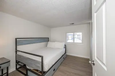 a bedroom with a bed in a room with a window at The Grand Elm Suite 2 in Ludlow
