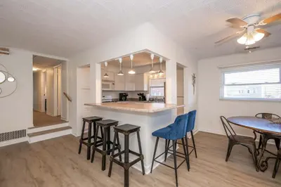 a kitchen and dining room with a table and chairs at The Grand Elm Suite 2 in Ludlow