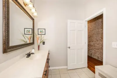 a bathroom with a sink and a mirror at Sweet Escape in Cincinnati