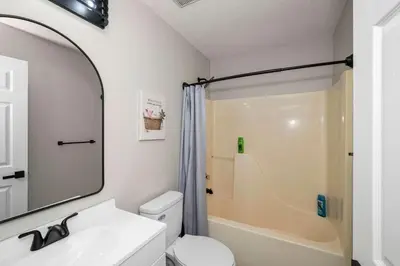 a bathroom with a shower and a sink and a toilet at The Restful Ark in Crittenden