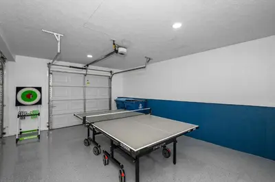 a room with a ping pong table and a basketball hoop at The Restful Ark in Crittenden