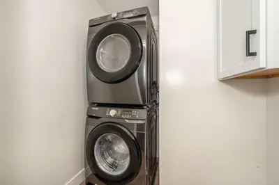 a dryer and a washing machine in a room at Historic Ludlow Suites - 2 Apts in Ludlow