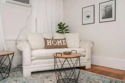 a living room with a couch and a table at Historic Ludlow Suites - 2 Apts in Ludlow