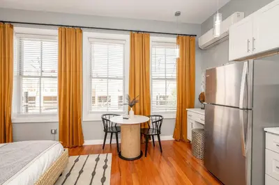 a kitchen with a bed and a table in a room at Findlay Market - Suite 4 for 2 in Cincinnati
