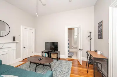 a living room with a couch and a table at Hackberry Retreat 1 Close to Downtown in Cincinnati
