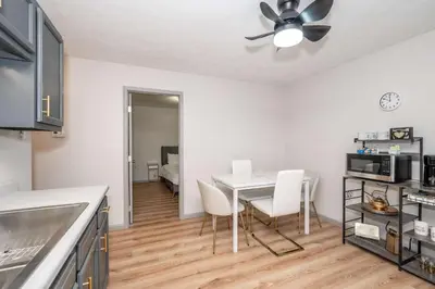a kitchen and dining room with a table and chairs at Arkstone Retreat 1 - Chic Downtown Escape in Williamstown