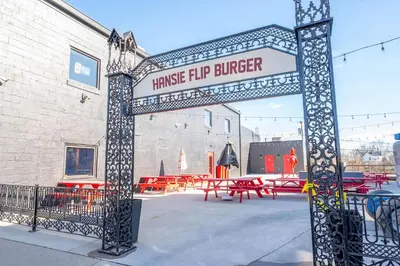 a metal gate with a sign that readsraise hip burger at Arkstone Retreat 1 - Chic Downtown Escape in Williamstown