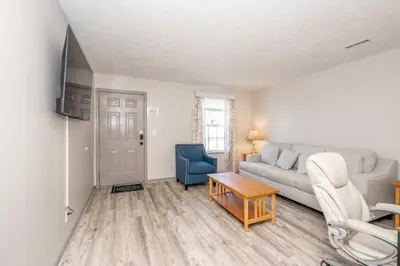 a living room with a couch and a table at Arkstone Retreat 2 - Chic 2 Bedroom in Williamstown