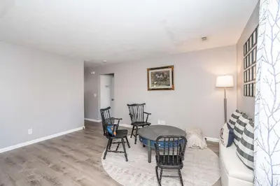 a living room with a table and chairs and a couch at Arkstone Retreat 3 in Williamstown