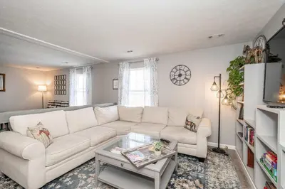 a living room with a white couch and a table at Arkstone Retreat 3 in Williamstown