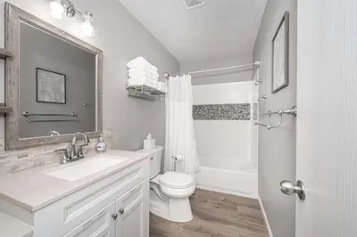 a bathroom with a toilet and a sink and a shower at Arkstone Retreat 3 in Williamstown