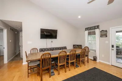 a dining room with a table and chairs at Lazy Days Waterfront for 12 in Williamstown