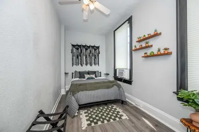 a bedroom with a bed and a ceiling fan at Chic Modern Gem with Style in Cincinnati