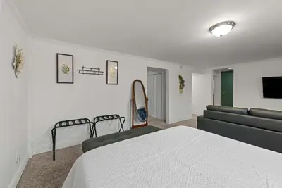 a bedroom with a bed and a couch at The Gahanna Getaway in Columbus