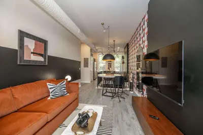 a living room with a couch and a table at Queen City Views Suites in Cincinnati