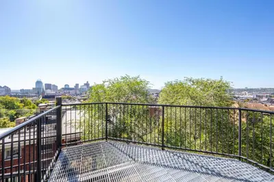 a balcony with a view of the city at Queen City Views Suites in Cincinnati