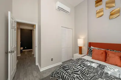 a bedroom with a bed with a zebra patterned bedspread at Queen City Views 1 Chic 1 BDR in Cincinnati