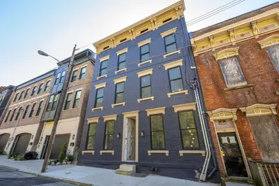 a blue building on the side of a street at Queen City Views 3 Chic 2 BDR in Cincinnati