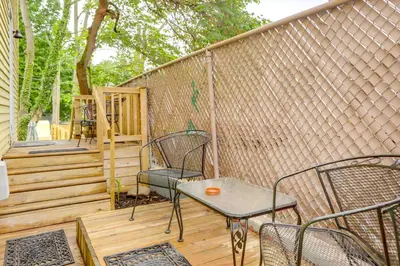 a patio with chairs and a table on a deck at 3 Mi to Dtwn Dog-Friendly Retreat in Dayton in Dayton