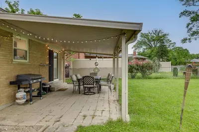 a patio with a table and chairs and a grill at 10 Mi to Dtwn Cincinnati Home with Patio and Yard! in Cincinnati