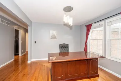 an office with a wooden desk in a room at Big Sky Retreat - Home for 10 in Fairfield