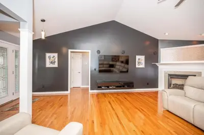 a living room with a couch and a fireplace at Big Sky Retreat - Home for 10 in Fairfield