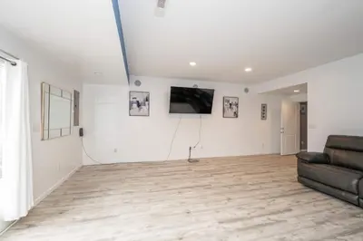 a living room with a couch and a television at Big Sky Retreat - Home for 10 in Fairfield