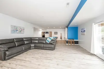 a living room with a couch and a table at Big Sky Retreat - Home for 10 in Fairfield