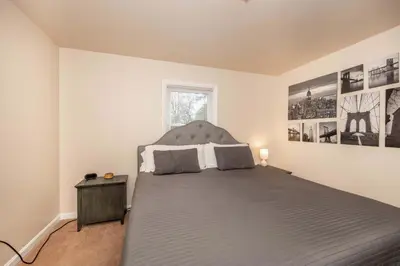 a bedroom with a large bed in a room at Kenwood Keys Suites - for 12 in Cincinnati
