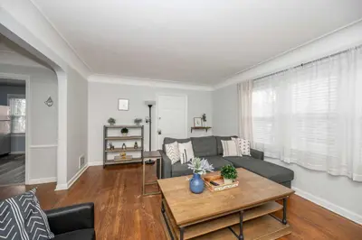 a living room with a couch and a table at Kenwood Keys Suites - for 12 in Cincinnati