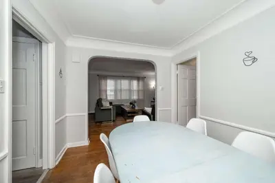 a white dining room with a white table and chairs at Kenwood Keys Suites - for 12 in Cincinnati