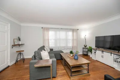 a living room with a couch and a tv at Kenwood Keys 1 - Cozy Stay for 6 in Cincinnati
