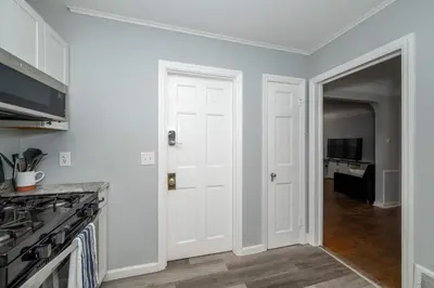 a kitchen with white walls and a white door at Kenwood Keys 1 - Cozy Stay for 6 in Cincinnati