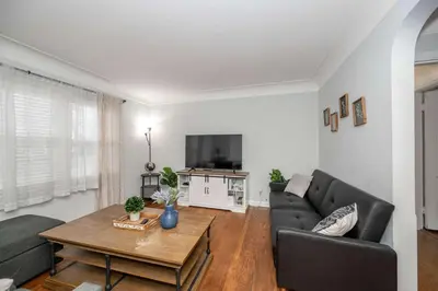 a living room with a couch and a table at Kenwood Keys 1 - Cozy Stay for 6 in Cincinnati