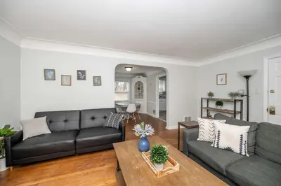 a living room with a couch and a table at Kenwood Keys 1 - Cozy Stay for 6 in Cincinnati
