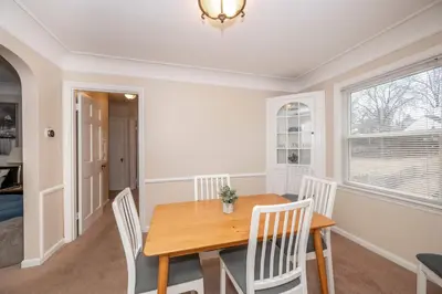 a dining room with a wooden table and chairs at Kenwood Keys 2 - Stay for 6 in Cincinnati