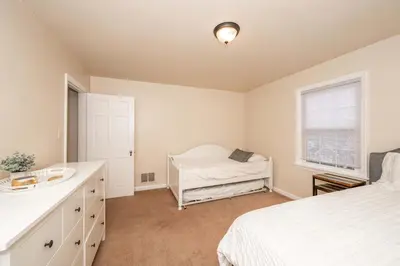 a bedroom with a bed and a sink in it at Kenwood Keys 2 - Stay for 6 in Cincinnati