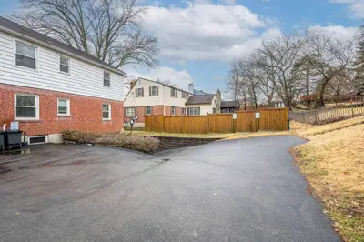 a driveway in front of a house with a fence at Kenwood Keys 2 - Stay for 6 in Cincinnati