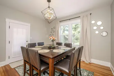 a dining room with a table and chairs at Bridgetown Bungalow in Cincinnati