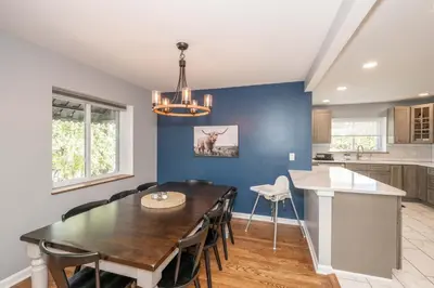 a dining room and kitchen with a table and chairs at Love 'n Life Haven in Cincinnati
