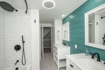 a bathroom with a white sink and a shower at Love 'n Life Haven in Cincinnati