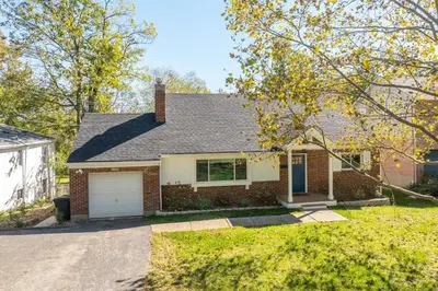 a brick house with a garage and a driveway at Love 'n Life Haven in Cincinnati