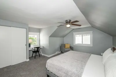 a bedroom with a bed and a ceiling fan at Love 'n Life Haven in Cincinnati